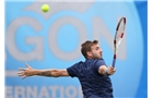 EASTBOURNE, ENGLAND - JUNE 16: Daniel Evans of Great Britain plays a backhand against Tobias Kamke of Germany during their Men's Singles first round match on day three of the Aegon International at Devonshire Park on June 16, 2014 in Eastbourne, England.  (Photo by Steve Bardens/Getty Images)